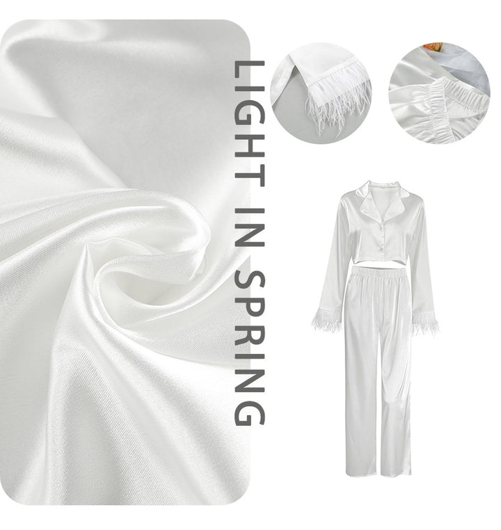 Dame Elegant cropped top og løstsiddende bukser med fjerdetaljer Stilla