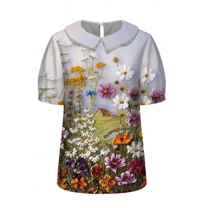 Dame kortærmet bluse med florale accenter og klassisk krave Skovae