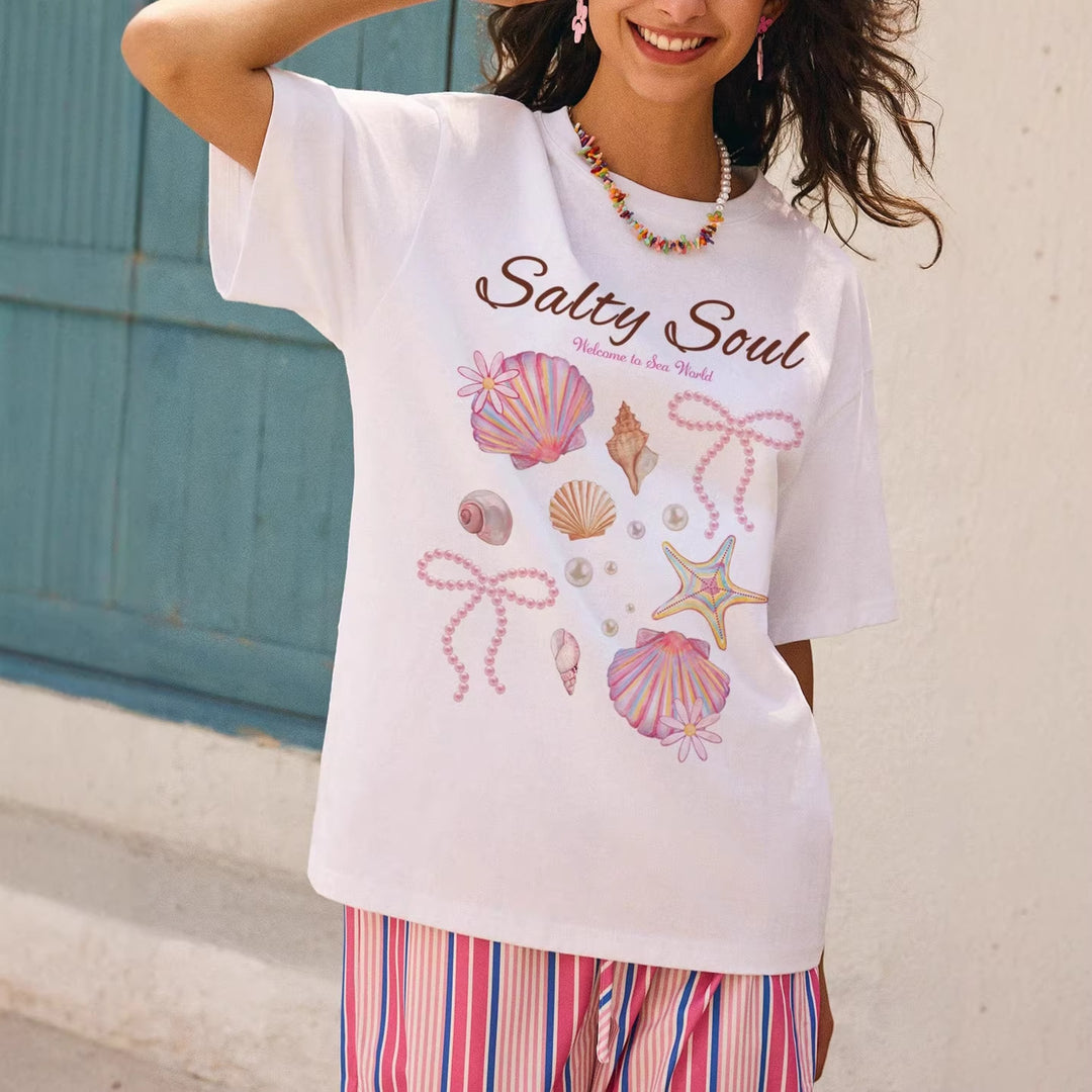 Dame Grafik T-shirt med maritimt muslingemotiv og afslappet snit Skovae