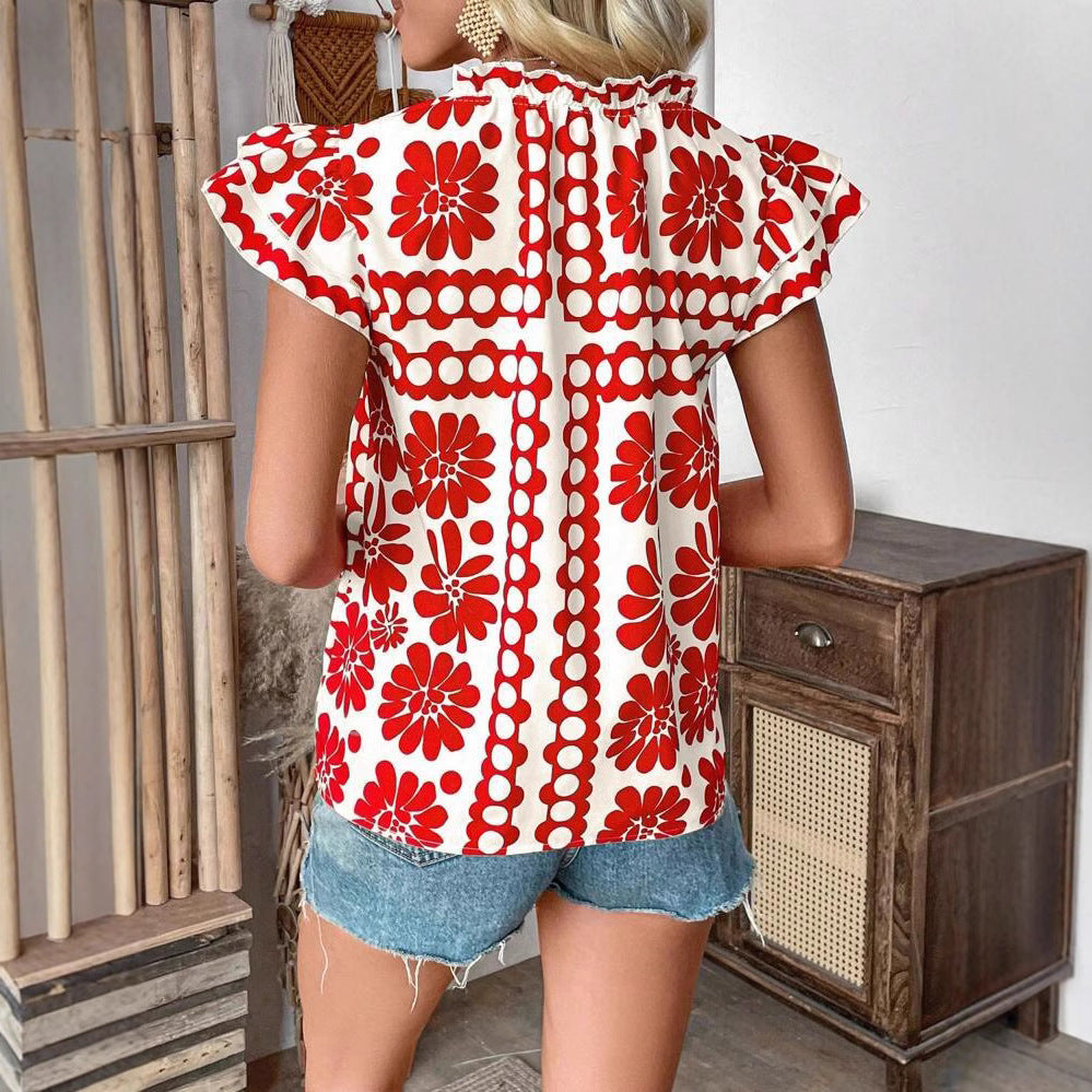 Damebluse med florale flæsedetaljer og frisk design Stilla