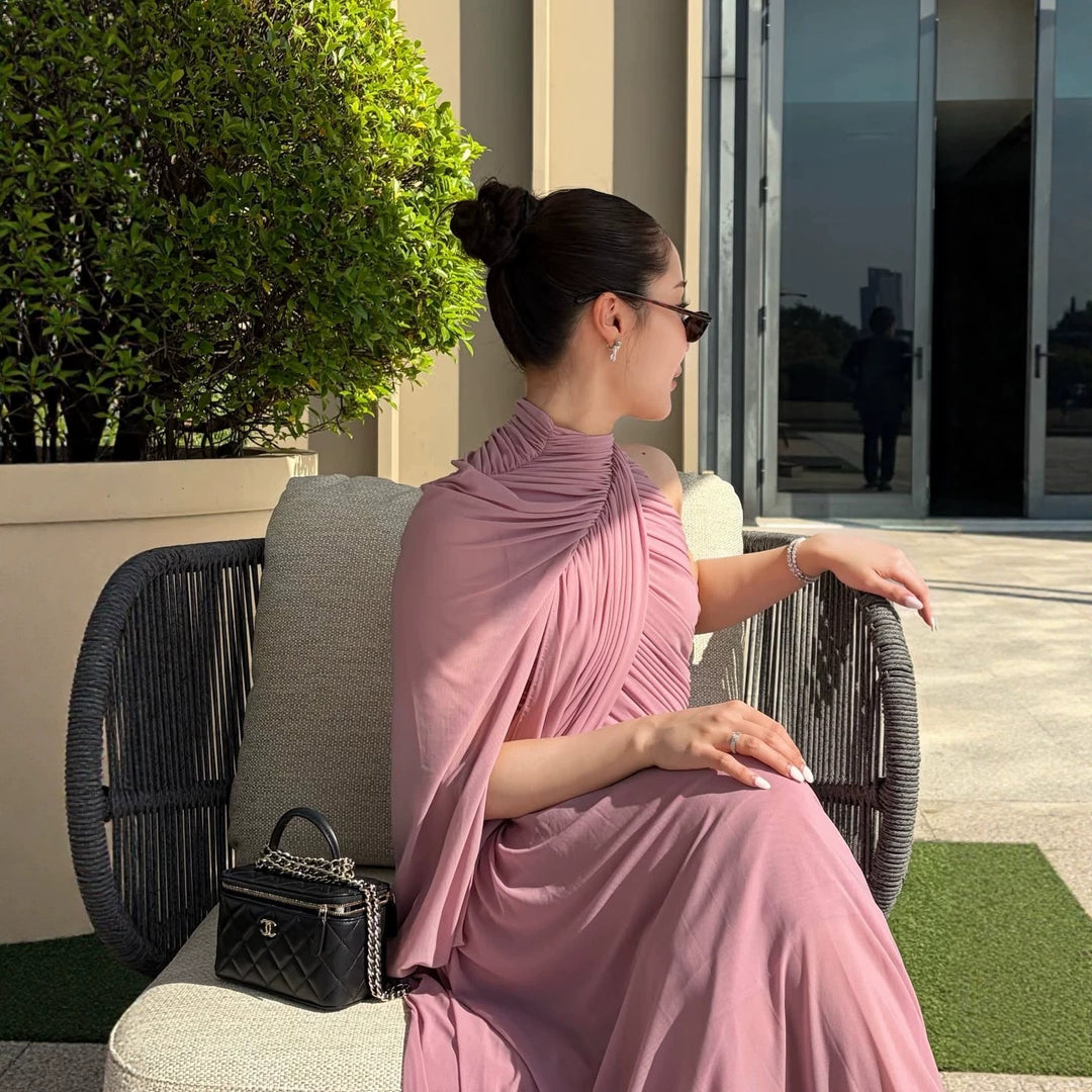 Dame Elegant wrap dress with asymmetric design and flowing drape Skovae