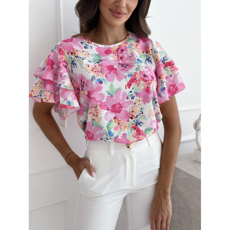 Damebluse med flæsedetaljer og blomstermotiv Stilla