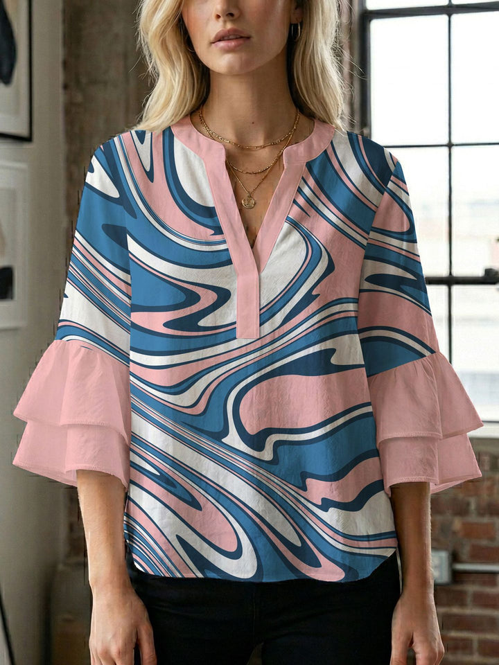 Dame bluse med voluminøse ærmer og kreativt trykdesign Skovae