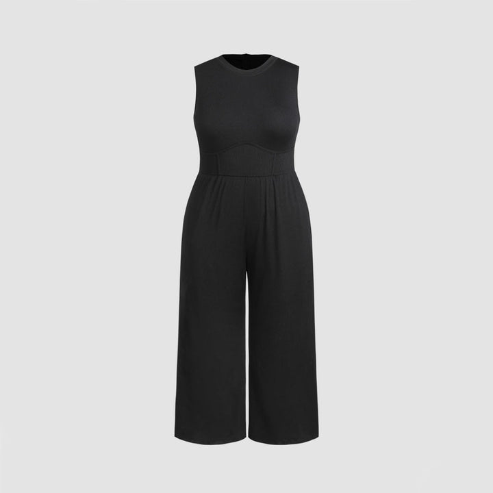 Dame jumpsuit med elegant off-shoulder design og praktiske sidelommer Skovae