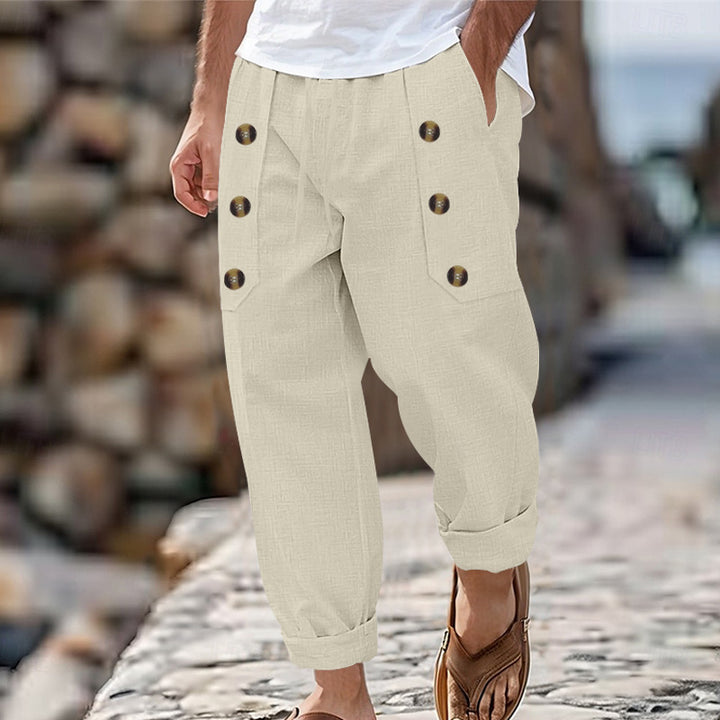 Herren nan loose linen pants with decorative button stripes, rolled ankle hem and side pockets Skovae