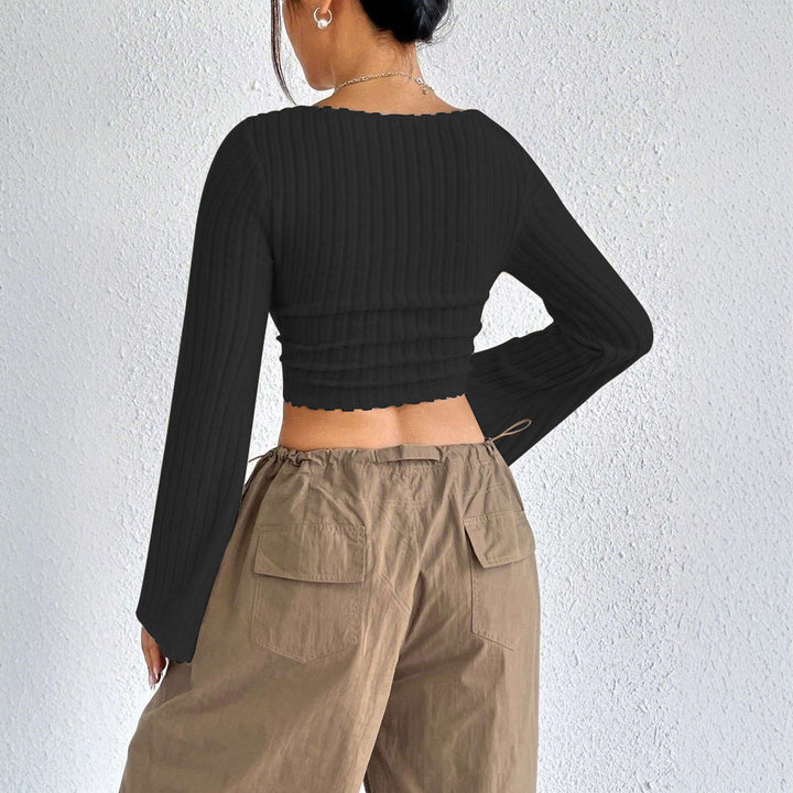 Kvinders langærmet crop top med dekorativ ribdesignet og afrundet bund Stilla