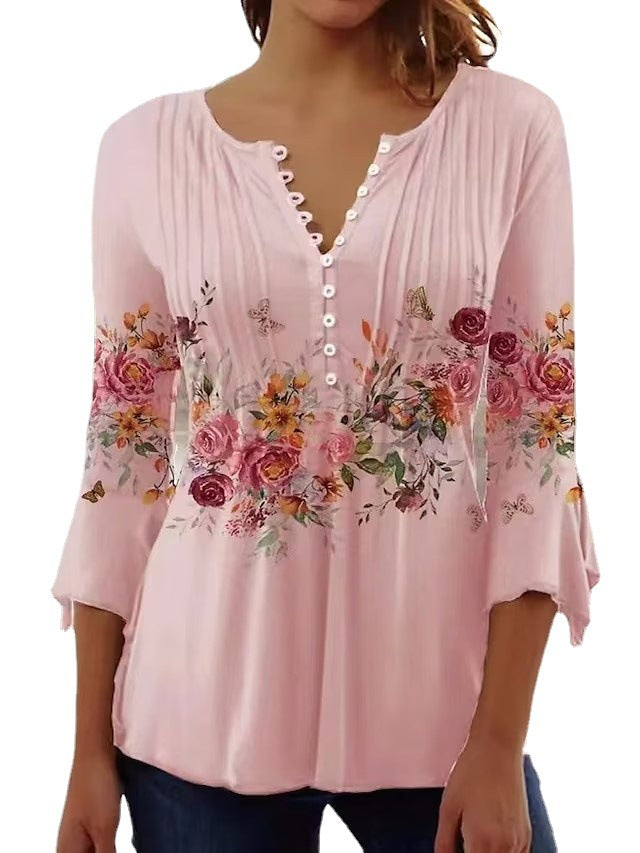 Damebluse med blomsterdesign og elegante knapdetaljer Stilla