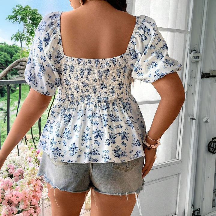 Damebluse med puffærmer og blomster mønster Stilla