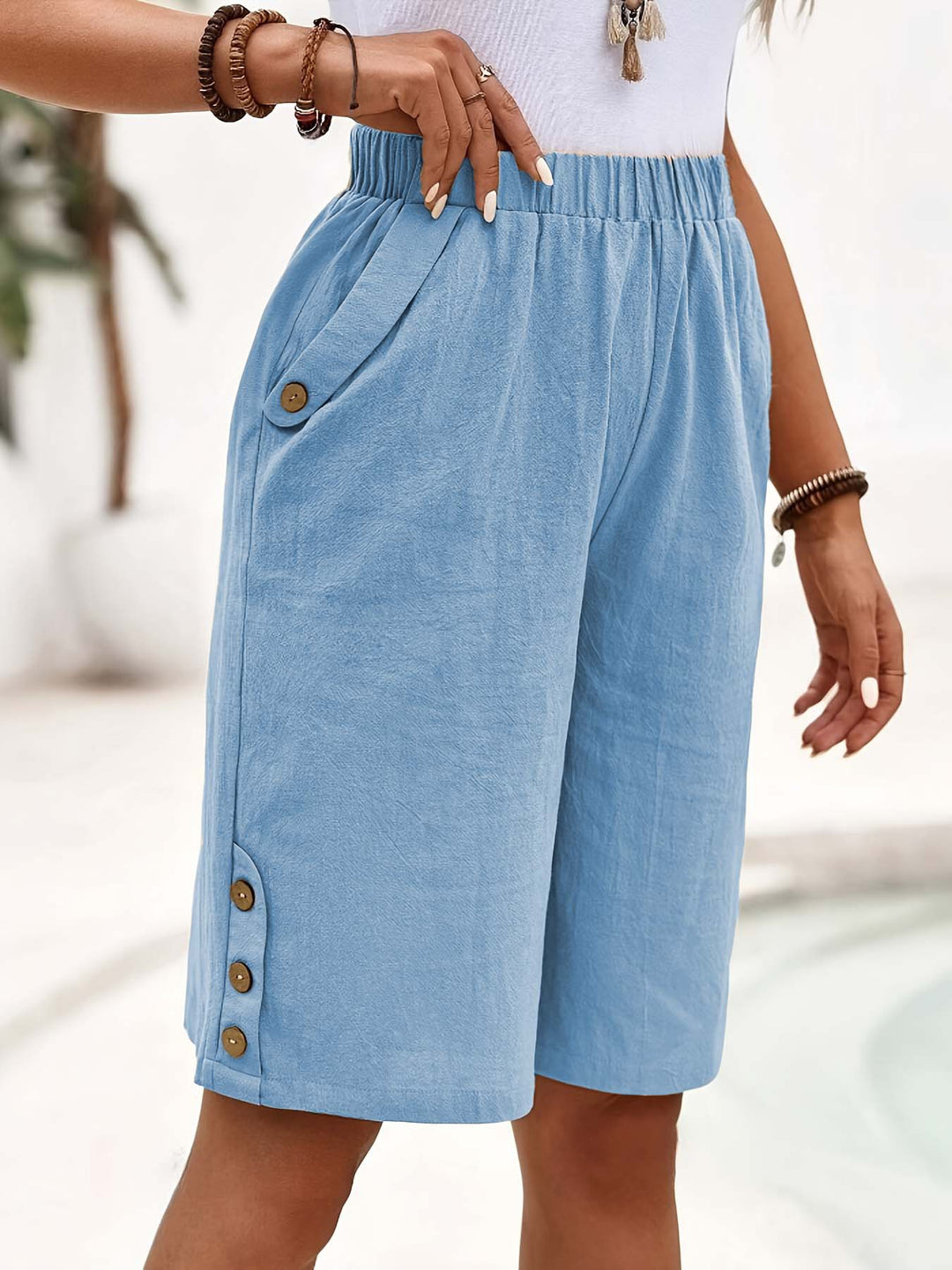 Dame afslappede shorts med elastisk liv og knapdetaljer Stilla