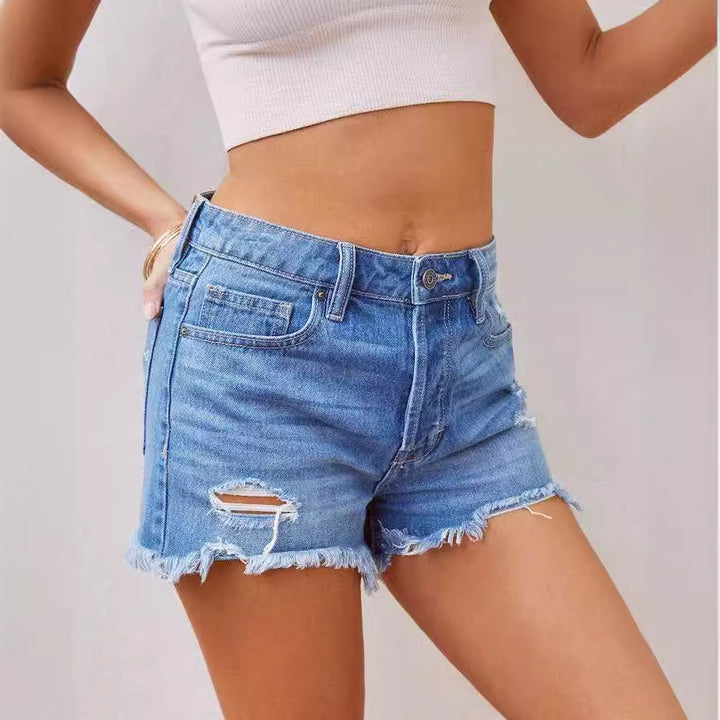 Dame jeansshorts i distressed look med frynset kant og høj talje Stilla