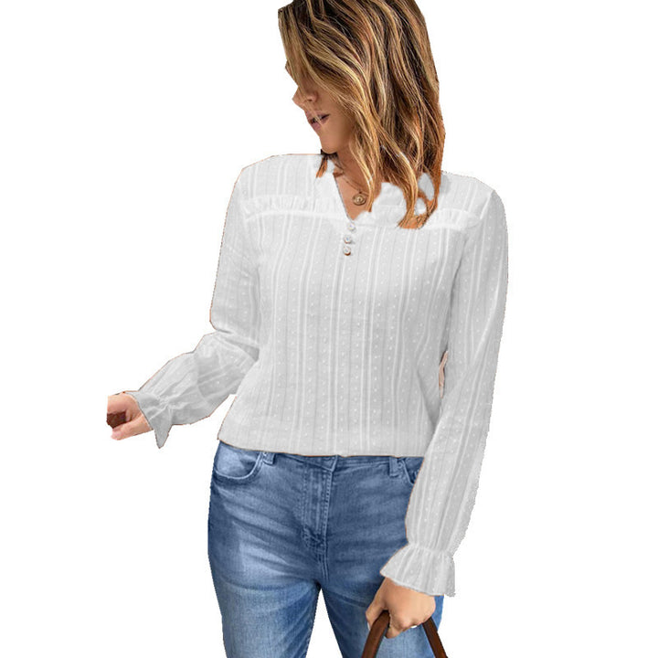 Damebluse med fin struktur og elegante knapdetaljer Stilla