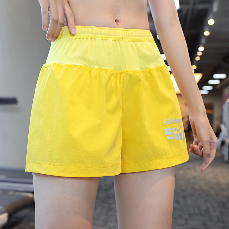 Dame Sporty Løbeshorts med sideventilation og elastisk talje Stilla