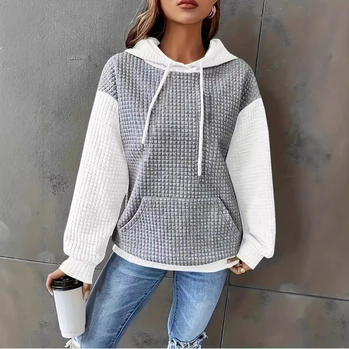 Dame hoodie med struktureret design og praktiske lommer Stilla