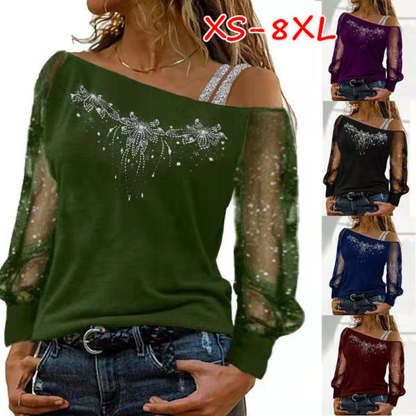 Dame top med transparente detaljer og floral strassdesign Stilla