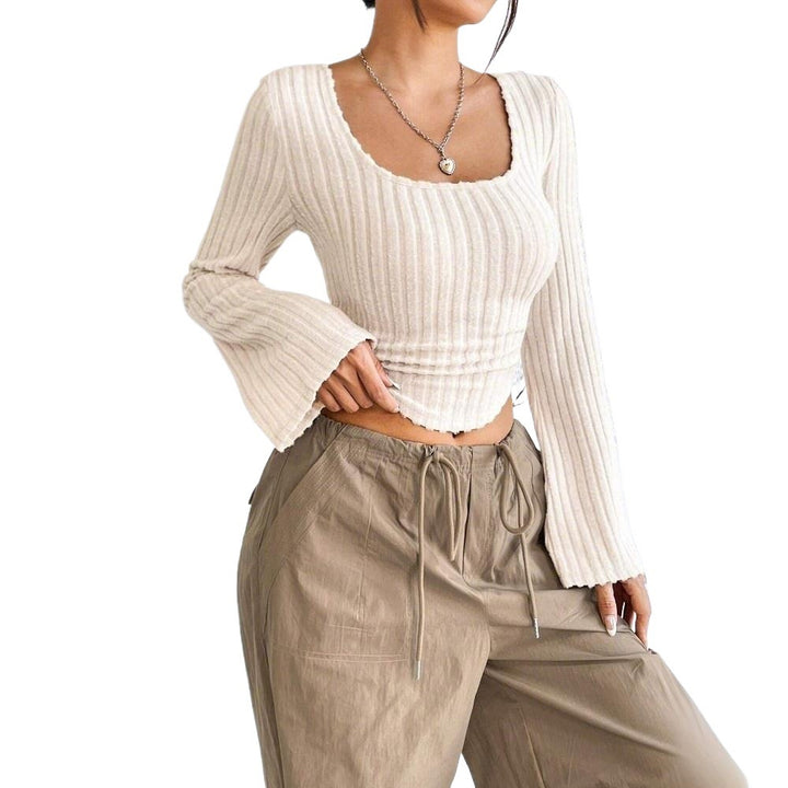 Kvinders langærmet crop top med dekorativ ribdesignet og afrundet bund Stilla
