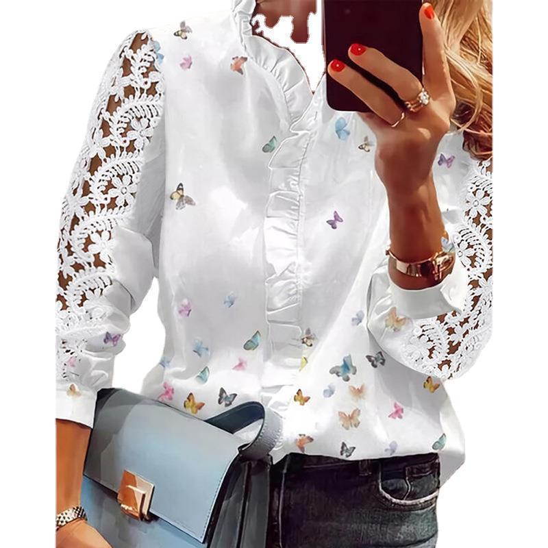 Damebluse med florale applikationer, volangdetaljer og spidsærmer Stilla