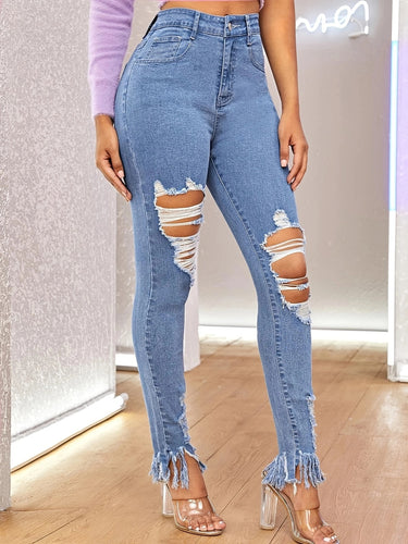 Dame Skinny Jeans i moderigtige Destroyed-design med frynsed kant og høje slids Stilla