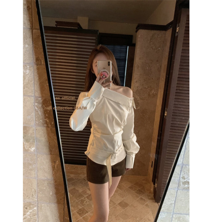 Kvinders off-shoulder bluse med elegant drapering