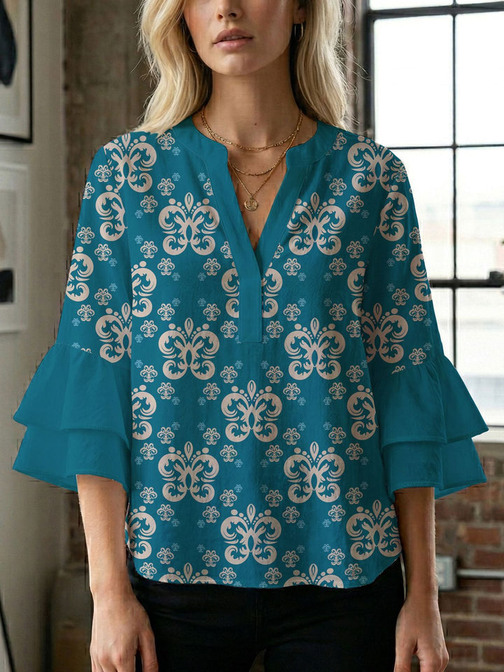 Dame bluse med voluminøse ærmer og kreativt trykdesign Skovae
