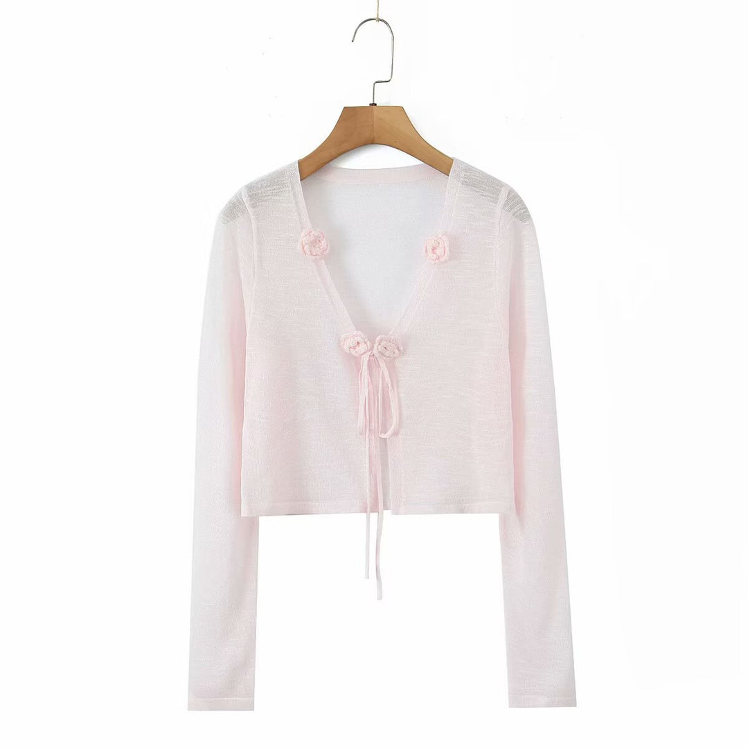Dame cropped strikjakke med blomstrede accenter og elegant bindebånd Stilla