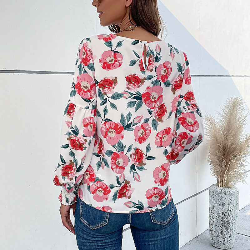 Damebluse med blomstertryk og voluminøse ærmer Stilla