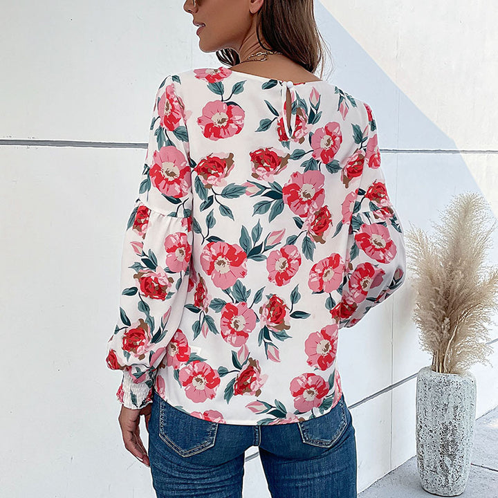 Damebluse med blomstertryk og voluminøse ærmer Stilla