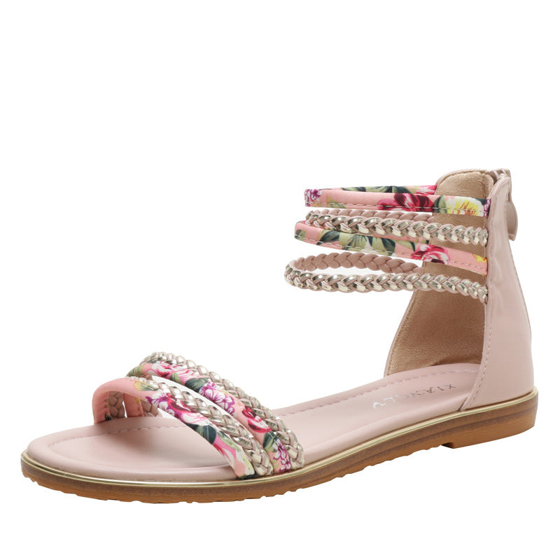 Dame fodsandaler med florale accenter og stilige flettede stropper Stilla