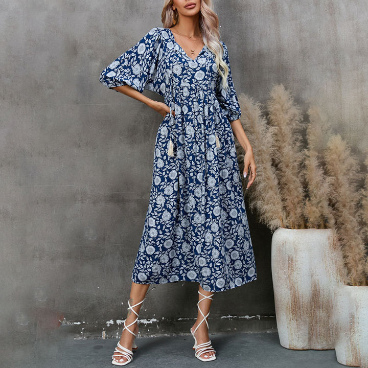 Dame midikjole med legende floral design og elegant talje Stilla