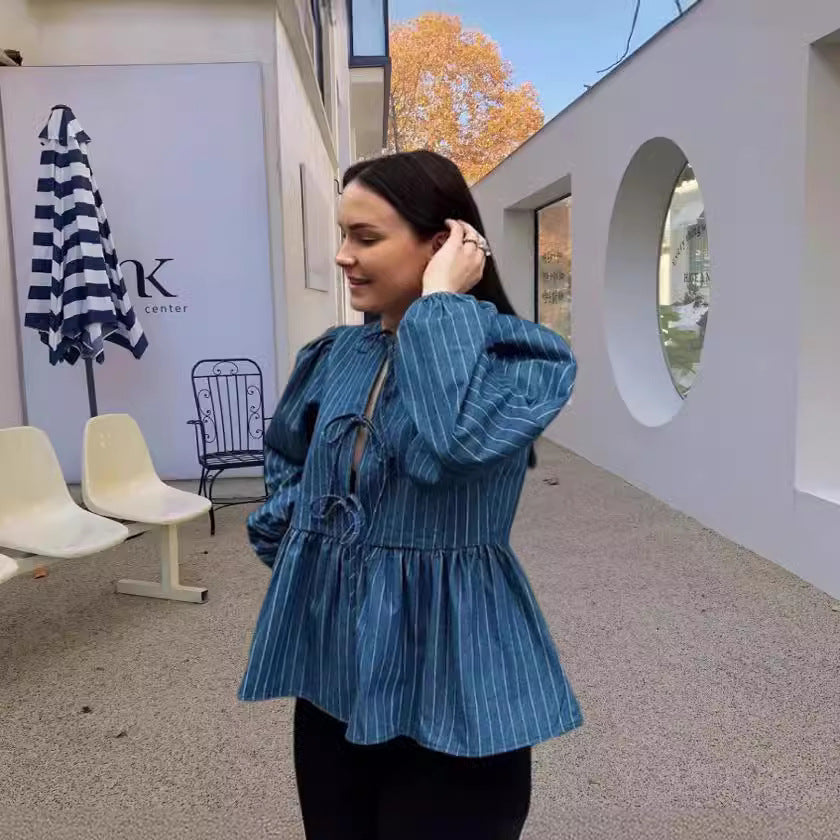 Dame skovhuggerbluse med afslappet snit og puffærmer Stilla