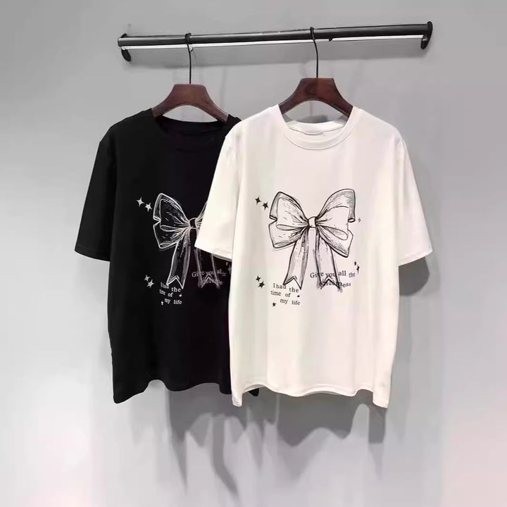Dame T-shirt med legende båndmotiv og inspirerende slogan Stilla