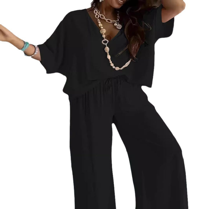 Dame jumpsuit med vidde snit og elegant V-udskæring Stilla