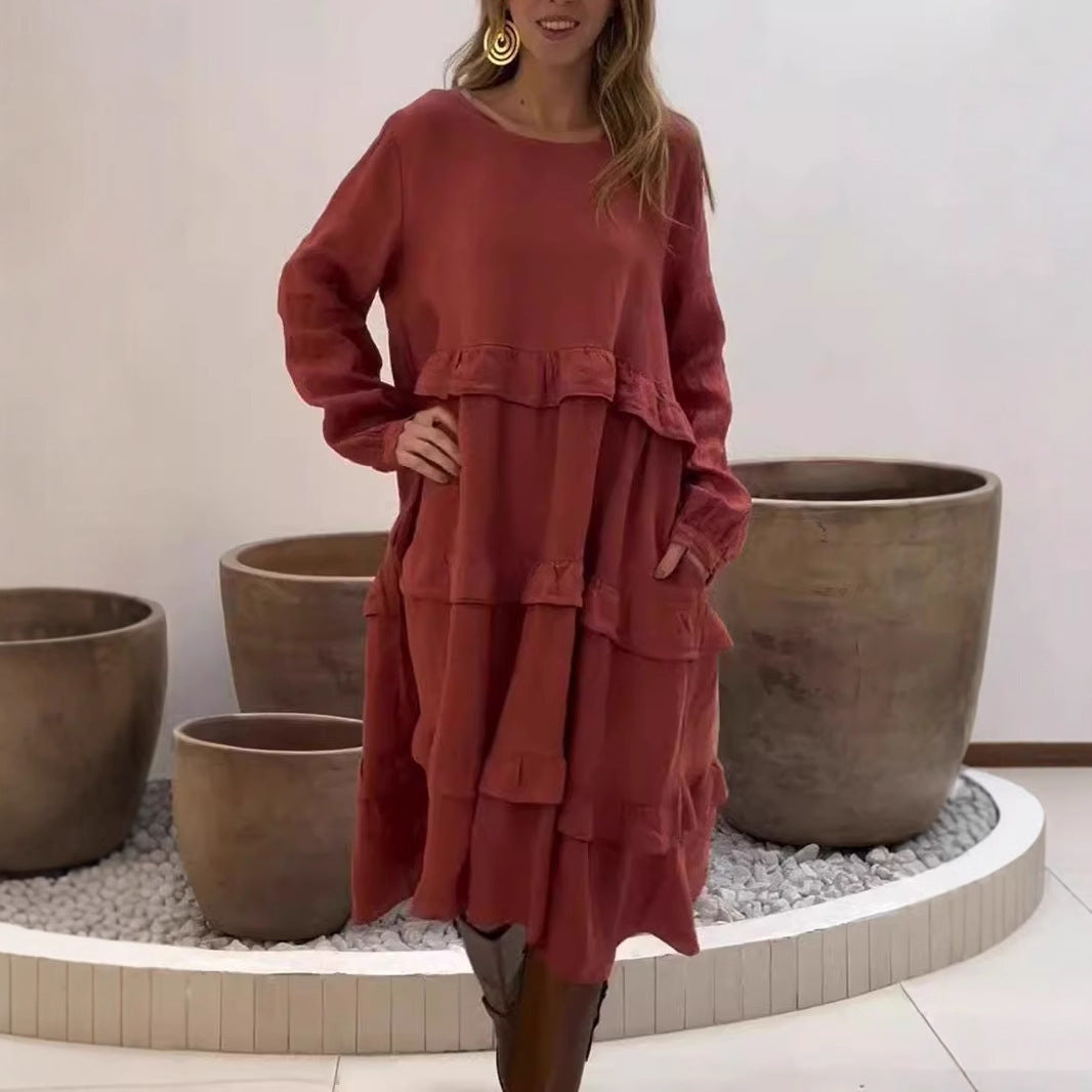 Dame linnedress med voluménøst lagdesign og sidelommer Stilla