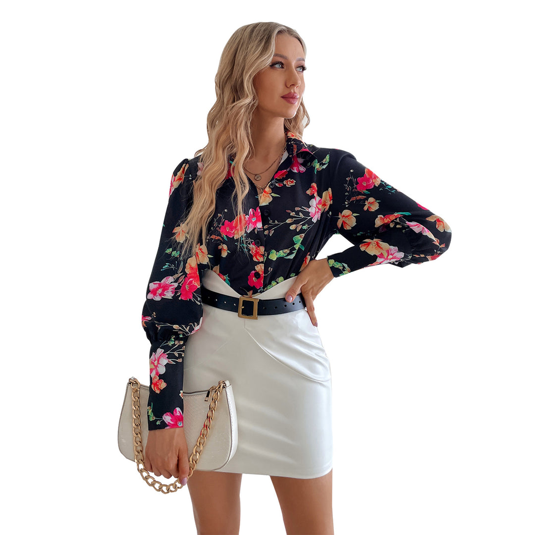 Kvindernes elegante bluse med blomsterprint og pufærmer Stilla
