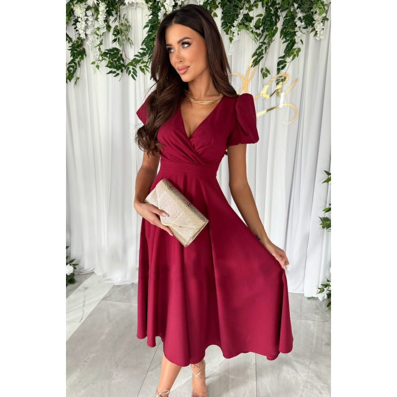 Dame elegant omslagskjole med voluminøse puffærmer og tidløst design Stilla