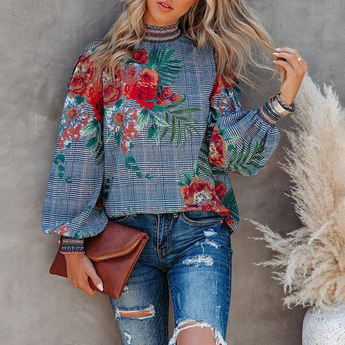 Damer modebluse med puffærmer og blomstret design Stilla