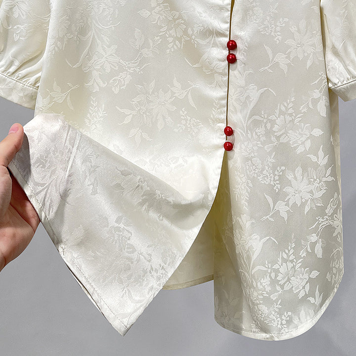 Damebluse med elegant struktur og dekorative knapper Stilla