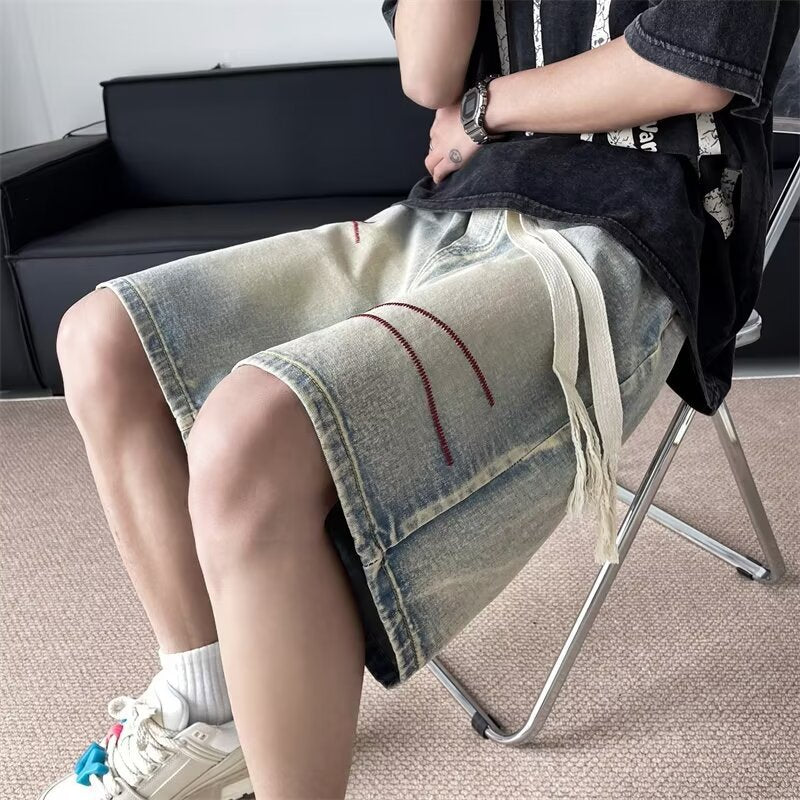 Herrer fashionable korte jeans-shorts med unikke distressed-detaljer og fleksibel talje Stilla