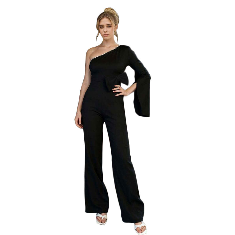 Dame jumpsuit med asymmetrisk design og elegant sløjfeapplikation Stilla