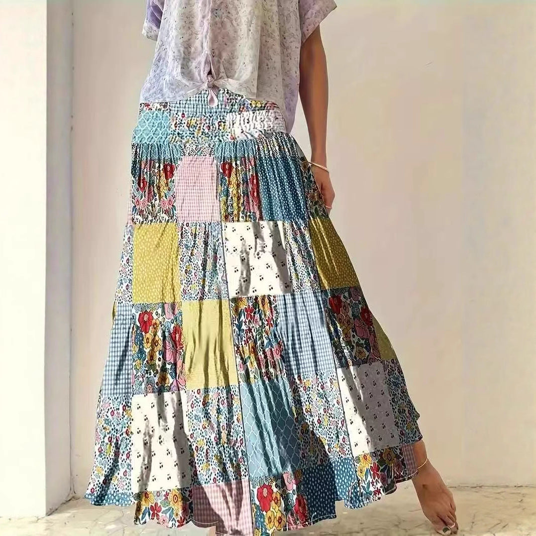 Dame maxikirtel i patchwork-design med elastisk talje og flydende snit Stilla