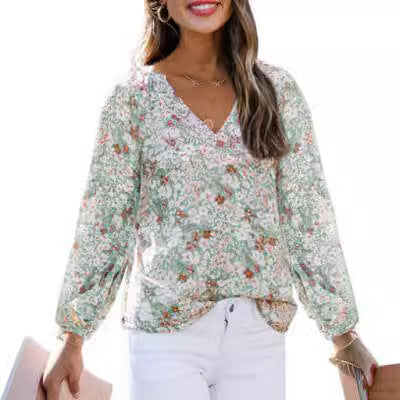 Damebluse med blomster mønstre og vidde ballonærmer Stilla