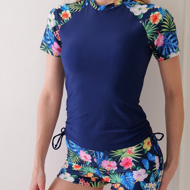 Dame Surf-dragt med blomsterdesign og mode accenter Skovae