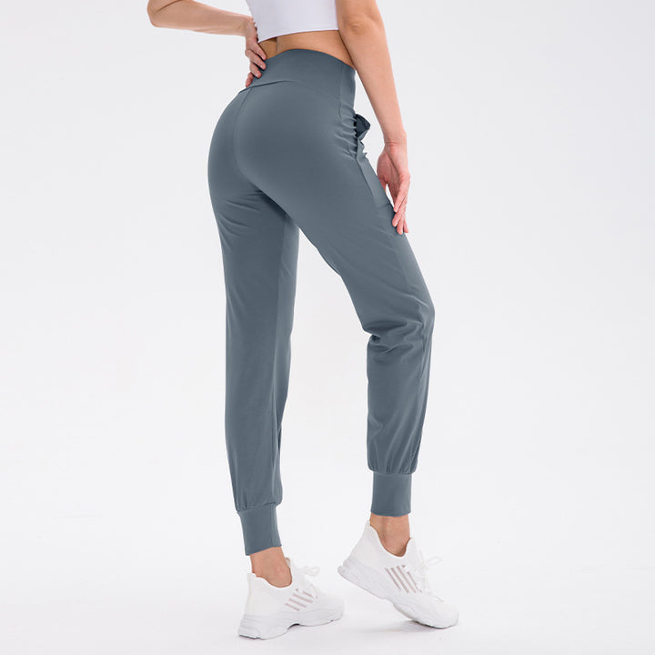 Dame elastisk sportsbukser med praktiske sidelommer og temperaturregulerende materiale Stilla