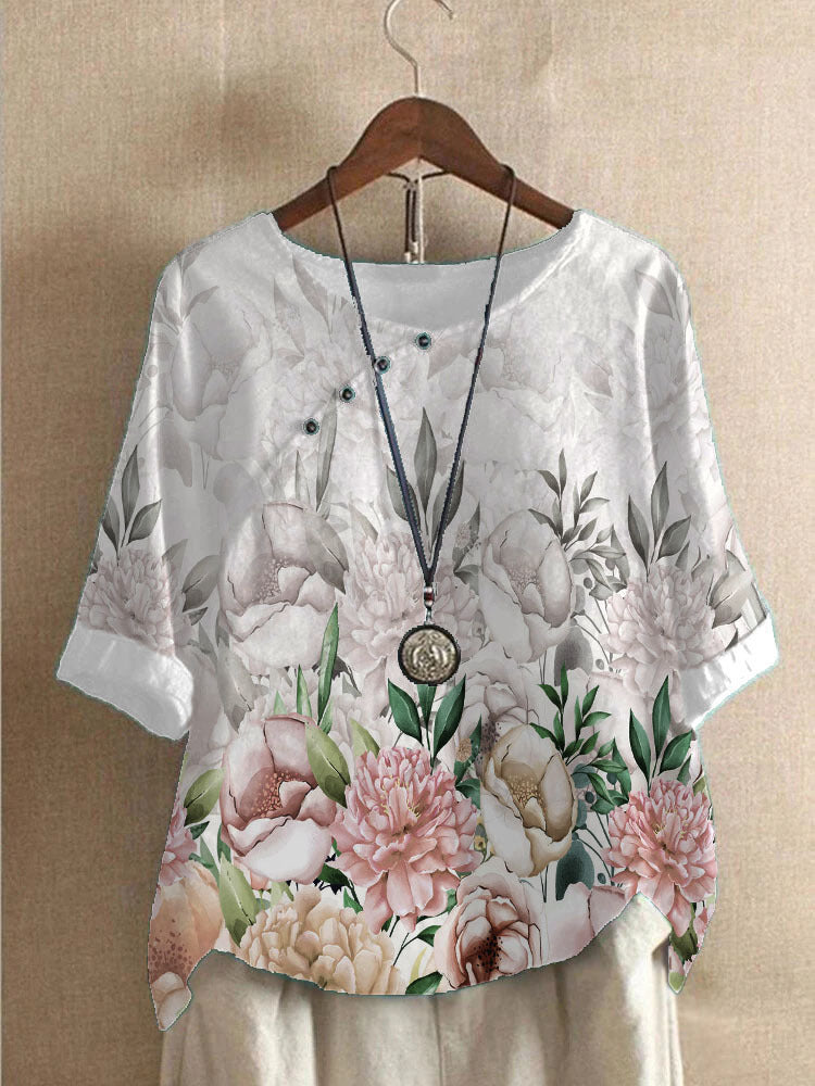 Damer bomuldsbluse med blomstertryk og elegant knaplukning Stilla