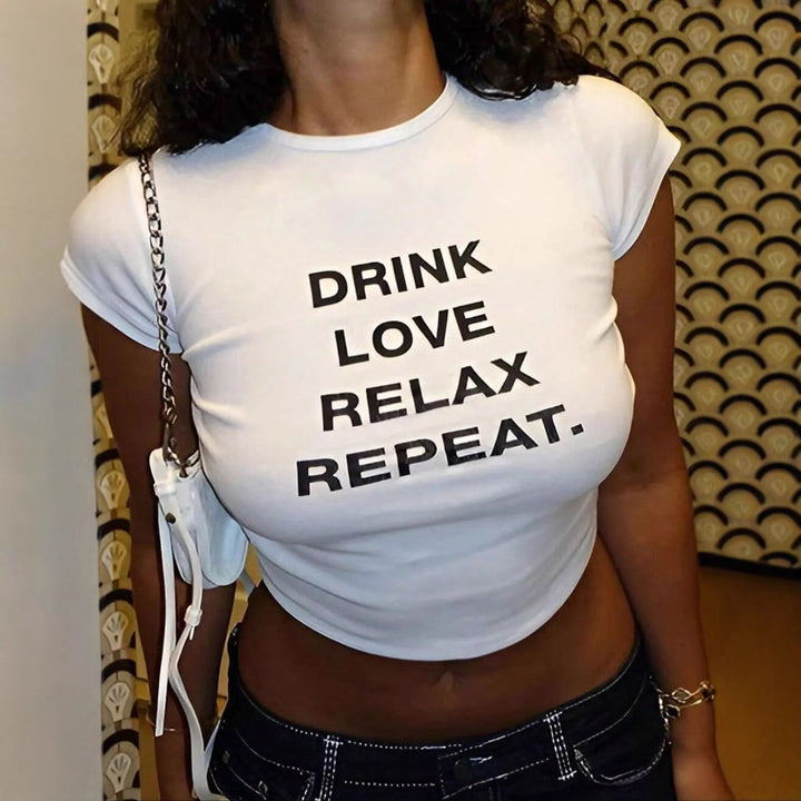 Dame Crop-T-shirt med inspirerende tekst og afslappet snit Skovae