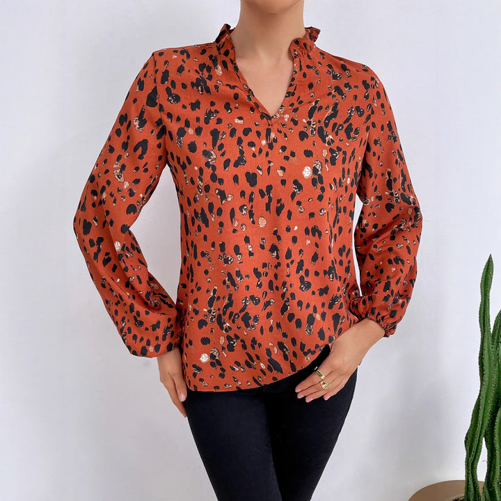 Kvinders bluse med blomsterlig leopardmønster og voluminøse ærmer Stilla
