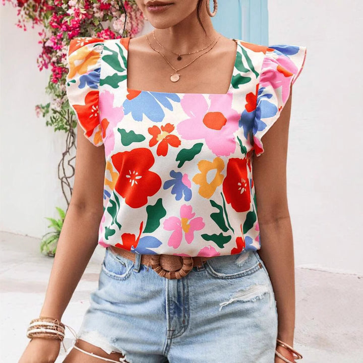 Damebluse med flæsekanter og blomstermotiver Stilla