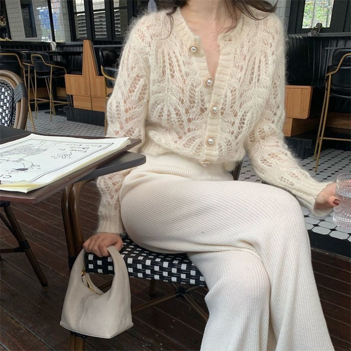 Kvindernes cardigan med åbent mønster og elegante knapdetaljer Stilla