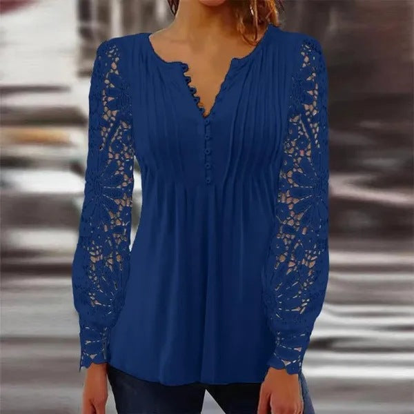 Damer spidsbluse med elegante knapdetaljer og voluminøse ærmer Stilla