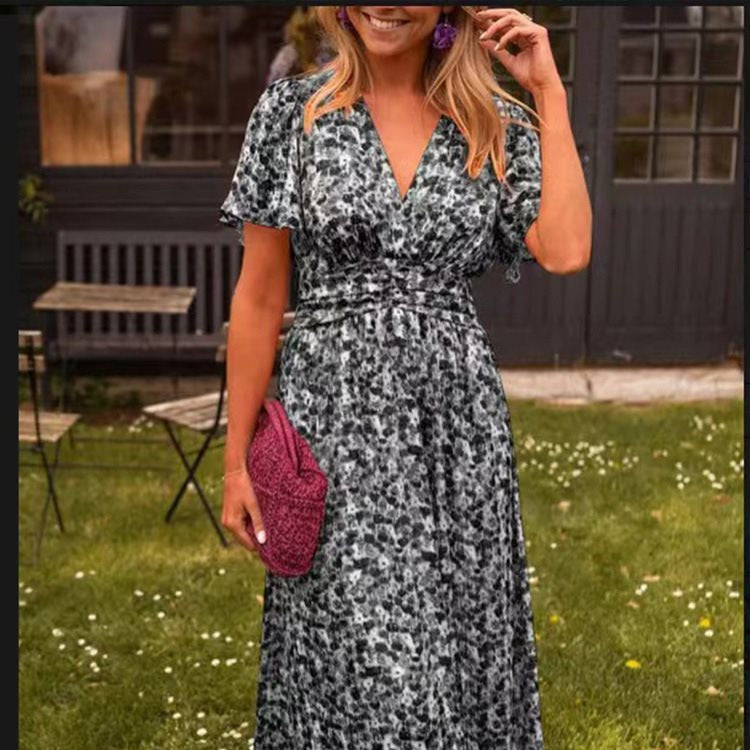 Dame maxikjole med elegant V-udskæring og legesyg puffærme Stilla