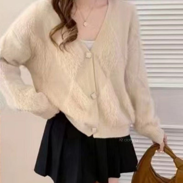 Kvindernes fluffy cardigan med knapdetaljer Stilla